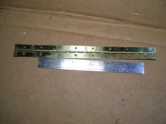CONTINUOUS PIANO HINGE BRASS PLATED STEEL 1-1/2″ X 16-1/2″ LONG WITH HOLES 0069