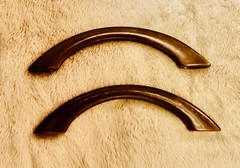 Two solid bronze oil rubbed Arc Cabinet Pulls from Rocky Mountain Hardware