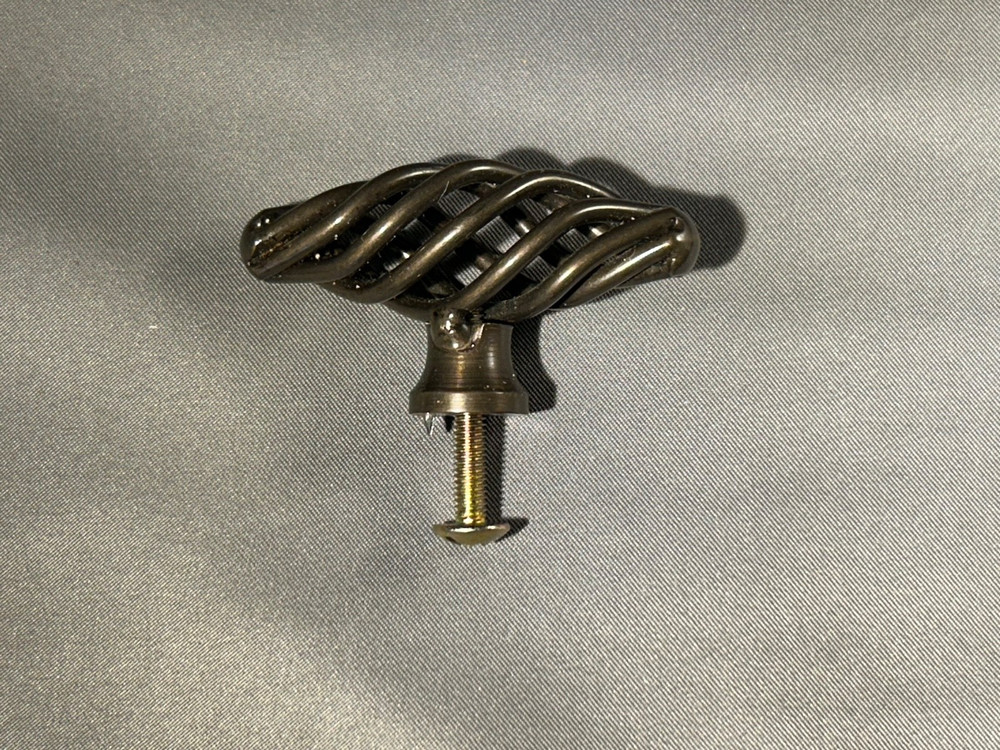 Cabinet/drawer knobs oval metal “bird cage” 2″ long 27 total knobs all the same.
