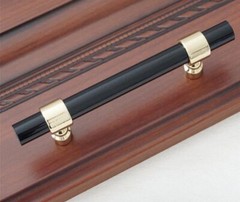 3 Drawer/Cabinet pulls 4.75” hole center to hole center Black and Gold